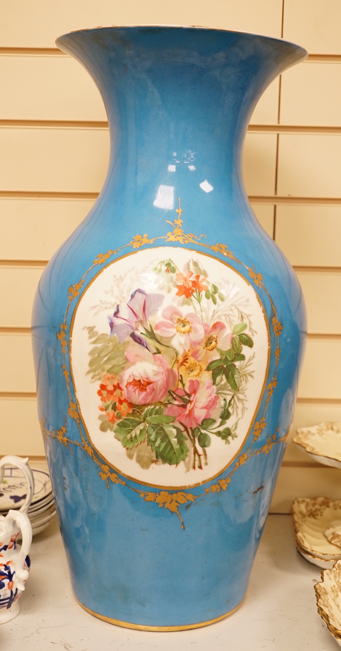 A large 19th century Sevres style blue porcelain decorated vase, 65cm (a.f.)